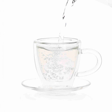 Taza de té de cristal popular con platillo